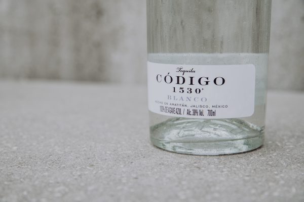 tequila bottle on neutral background